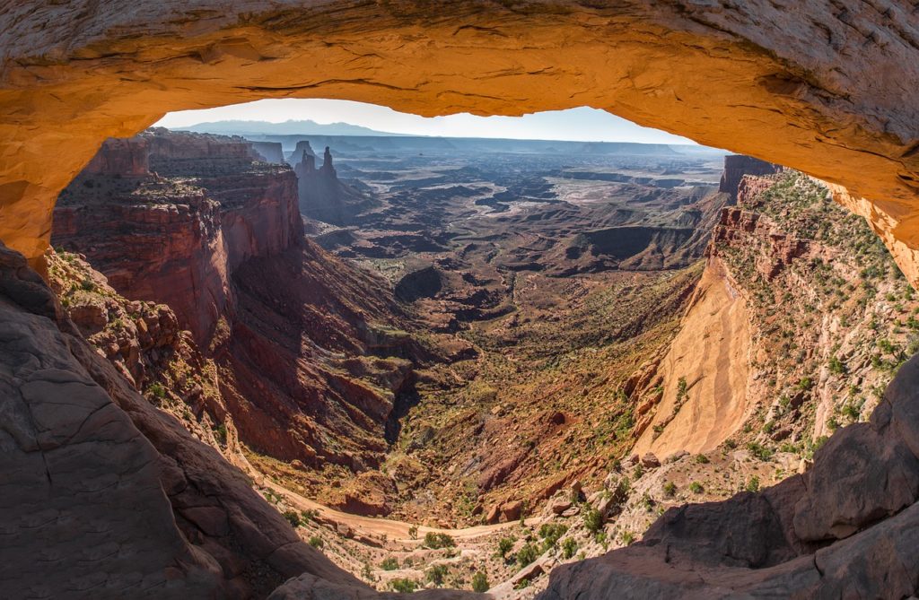 Mesa Arch is one of the most popular places to visit in Canyonlands. Its popularity, combined with a tiny parking lot, can make a midday visit here torture. 