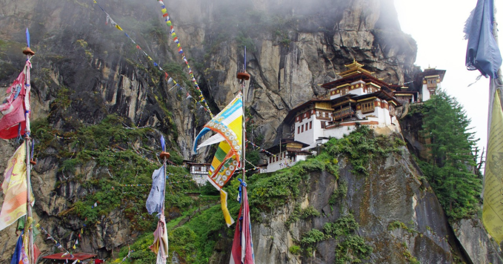 Himalaya in India, House or temple in the mountans and some colorful flags. Nice spot to add to your world trip