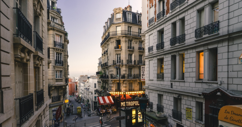 paris monmatre. high buildings in the city and panels on the buildings. view goes downhill