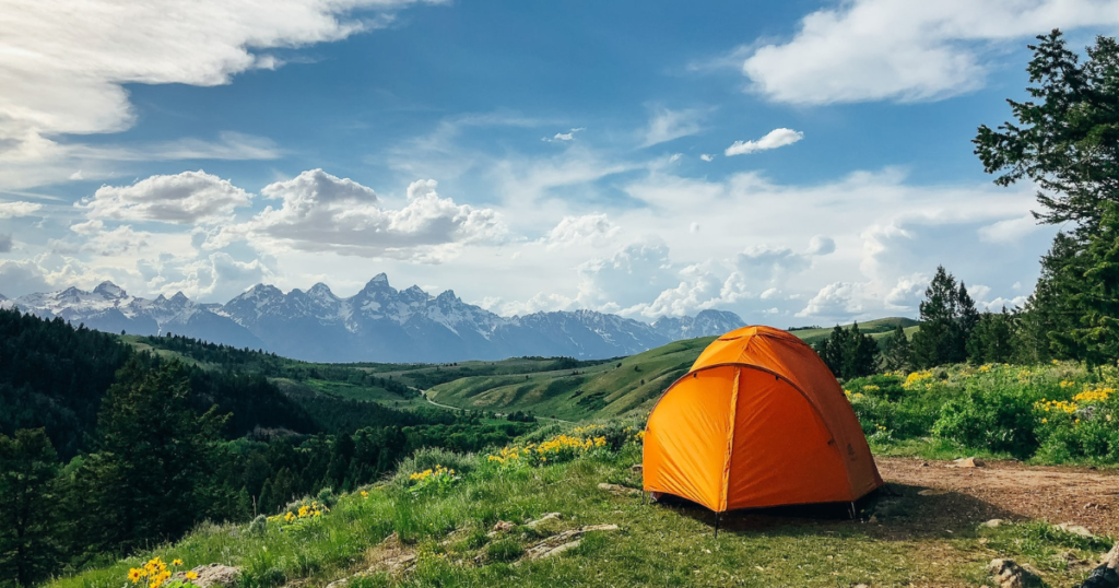 tent on a beautiful spot in the mountains with an amazing view of landscape and nicce weather. 