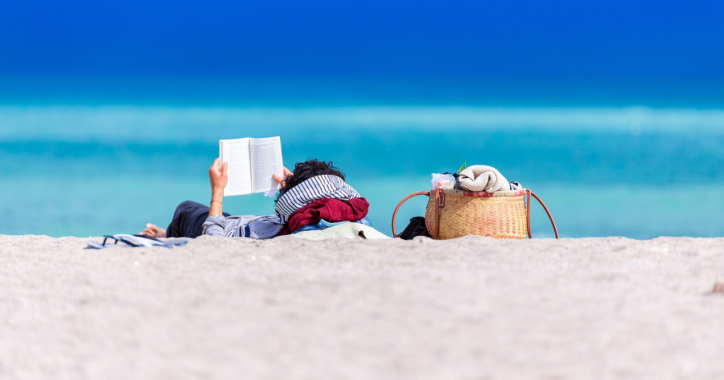 reading at the beach. best books for vacation 